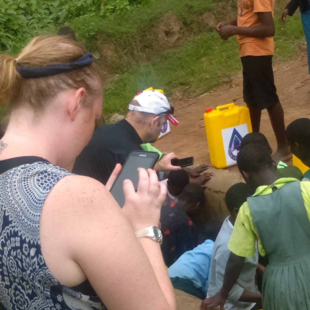 Youths As Volunteer Integrated Network Society volunteers helping children during annual walk for water event