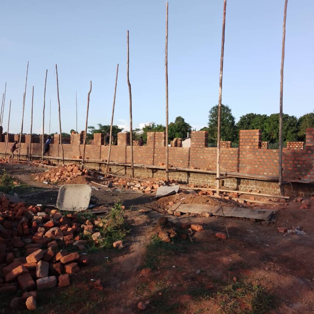 Placing scaffolding for construction of main building YAVINS Education Centre Uganda